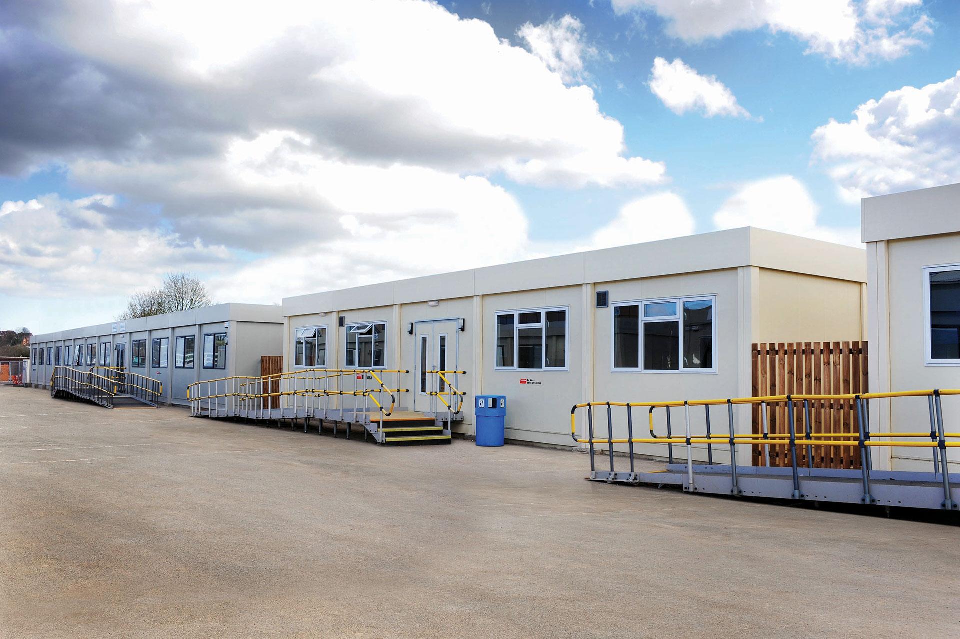 Row of portable classrooms in a school yard